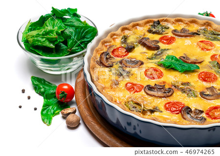 Baked homemade quiche pie in ceramic baking form Baked homemade quiche pie in ceramic baking form 46974265