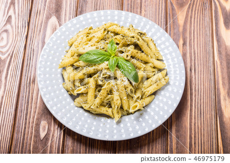 Italian penne pasta with sauce pesto Italian penne pasta with sauce pesto 46975179