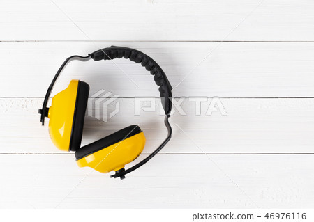 Image of construction safety equipment flat lay on white wooden. 46976116