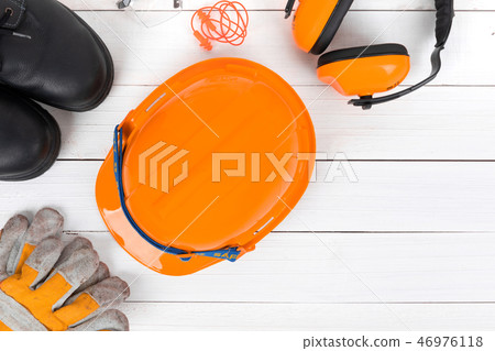 Banner image of construction safety equipment flat lay on white 46976118