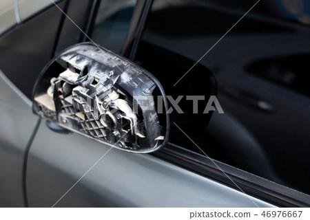 Car with broken rear mirror closeup Car with broken rear mirror closeup 46976667