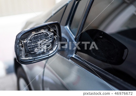 Car with broken rear mirror closeup 46976672