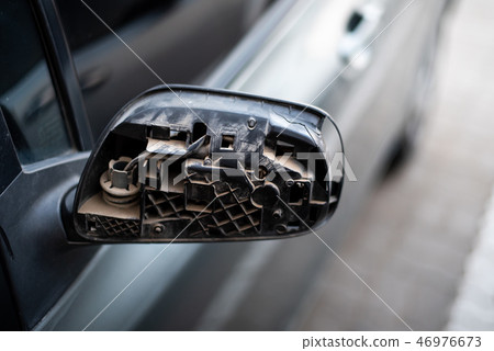 Car with broken rear mirror closeup 46976673