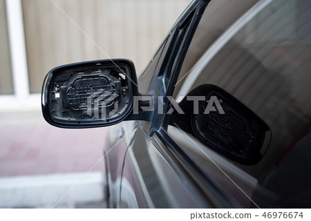 Car with broken rear mirror closeup Car with broken rear mirror closeup 46976674