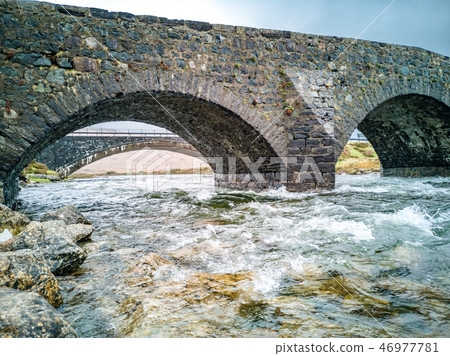Sligachan Old stone Bridge over River Sligachan with Beinn Dearg Mhor and Marsco peak of Red Cuillin Sligachan Old stone Bridge over River Sligachan with Beinn Dearg Mhor and Marsco peak of Red Cuillin 46977781