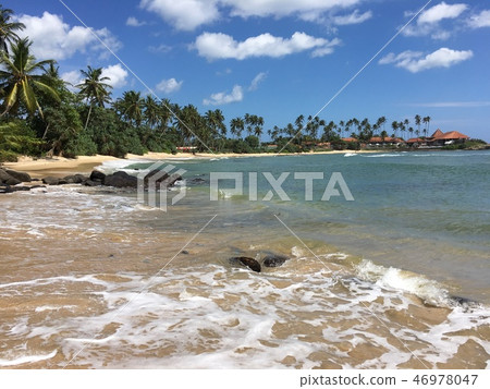 Beautiful tropical beach with great waves. Beautiful tropical beach with great waves. 46978047