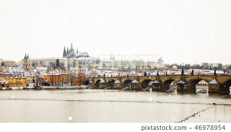 Prague Castle and Charles Bridge at winter, Czech Republic. 46978954