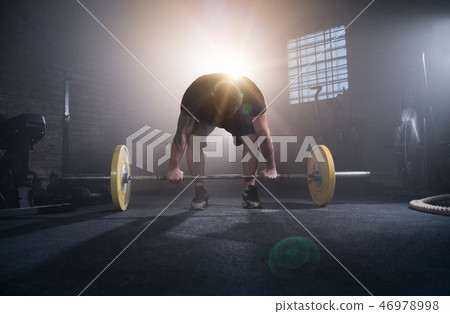 Weightlifter preparing for training. 46978998