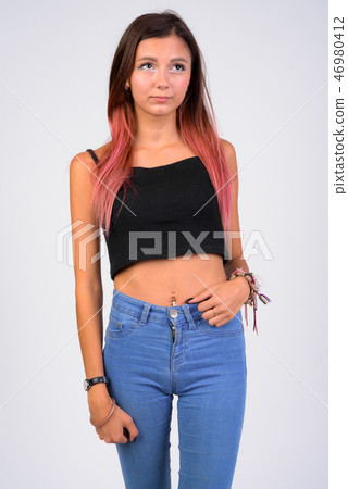 Portrait of young beautiful woman thinking against white background Portrait of young beautiful woman thinking against white background 46980412