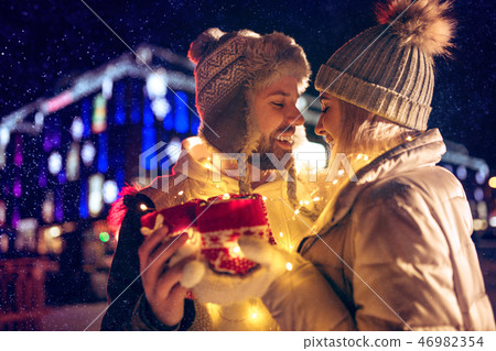 Adult couple hanging out in the city during Christmas time 46982354