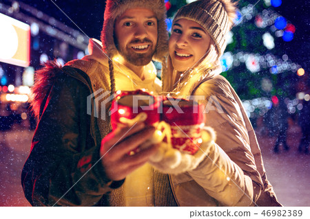 Adult couple hanging out in the city during Christmas time 46982389