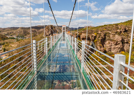 glass suspension bridge in the mountains 46983621