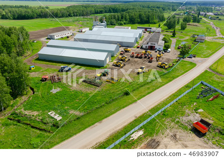 Farmer machine yard in Verhovina. Russia Farmer machine yard in Verhovina. Russia 46983907