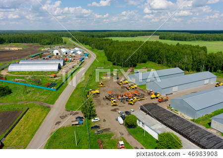 Farmer machine yard in Verhovina. Russia Farmer machine yard in Verhovina. Russia 46983908