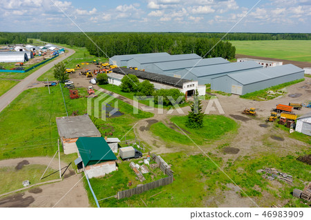 Farmer machine yard in Verhovina. Russia Farmer machine yard in Verhovina. Russia 46983909