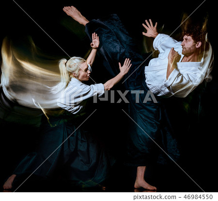 Aikido bodokas man and woman isolated black background Aikido bodokas man and woman isolated black background 46984550