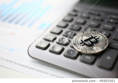 Coin crypto currency bitcoin lies on the keyboard Coin crypto currency bitcoin lies on the keyboard 46985081