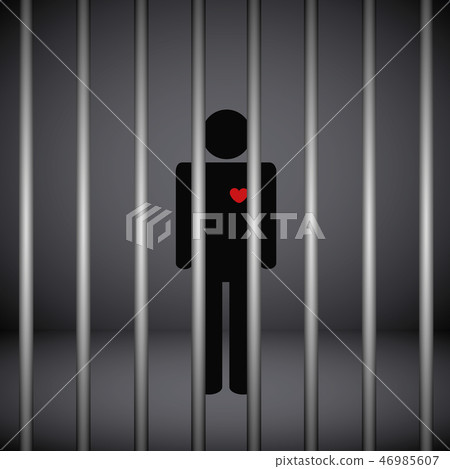man with red heart in jail on dark background 46985607