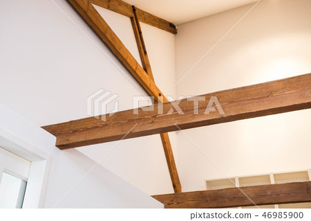 Wooden design. Wooden beams on ceiling as a design element. Modern interior. 46985900
