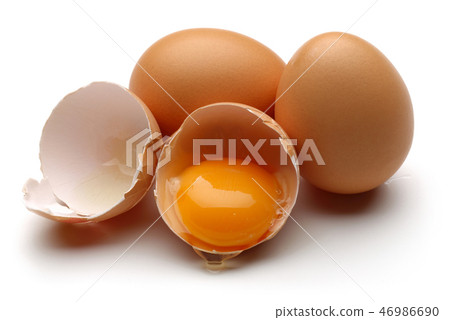 Broken egg on white background Broken egg on white background 46986690