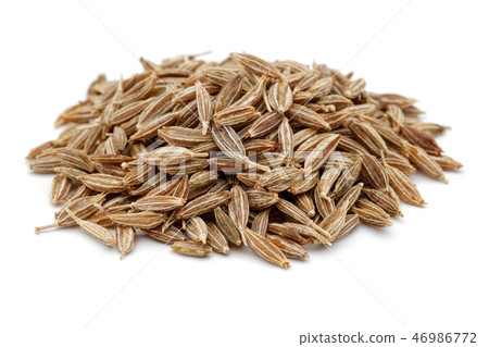Heap of Cumin seeds on white background 46986772