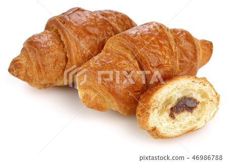 Sliced croissant with chocolate 46986788