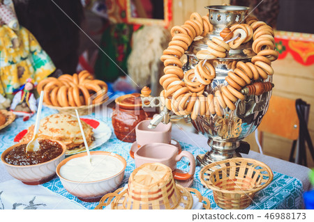 Samovar on the table with jam and sour cream at Shrovetide Samovar on the table with jam and sour cream at Shrovetide 46988173