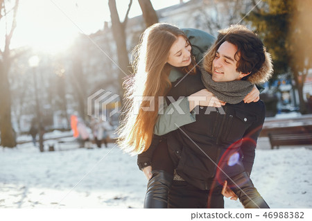 Loving couple walking in a winter park 46988382