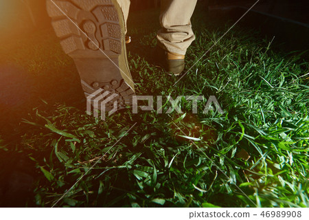 Man walking on green grass Man walking on green grass 46989908