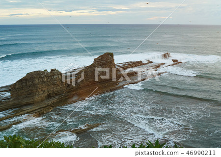 Magnific big rock in ocean 46990211