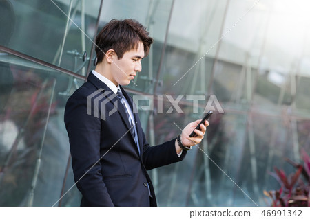 Business man using the smart phone  46991342
