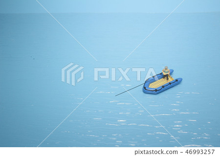 a figure fisherman catching a fish boat a figure fisherman catching a fish boat 46993257