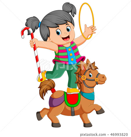 a girl is playing with the ring and candy stick a girl is playing with the ring and candy stick 46993820