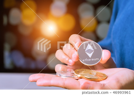 woman hold cryptocurrency Ethereum 46993961