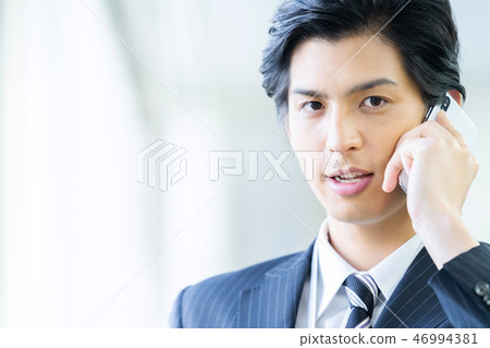 Male employee who calls a young businessman Male employee who calls a young businessman 46994381
