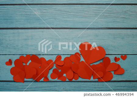 Red paper hearts on a blue wooden background Red paper hearts on a blue wooden background 46994394