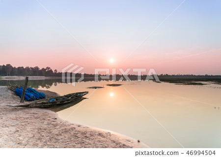 Fishing boat parking on the riverside on sunset 46994504