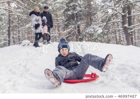 child is skating on the ice-boat 46997487