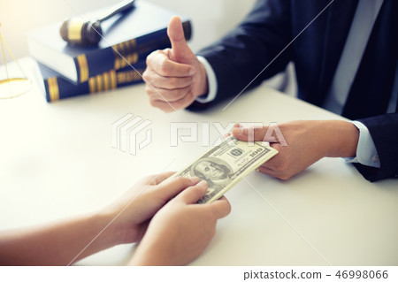 Judge lawyer gavel with bribe money in law firm Judge lawyer gavel with bribe money in law firm 46998066