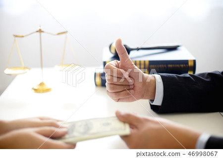 Judge lawyer gavel with bribe money in law firm 46998067