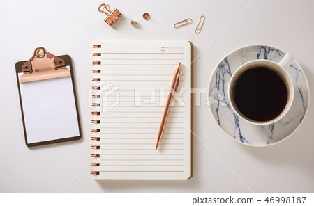 Notebook, clipboard, coffee cup and pen on desk 46998187