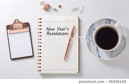 New year resolutions on notebook with coffee cup 46998188