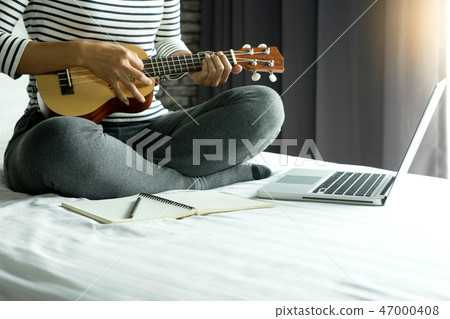 young woman write a song or music young woman write a song or music 47000408