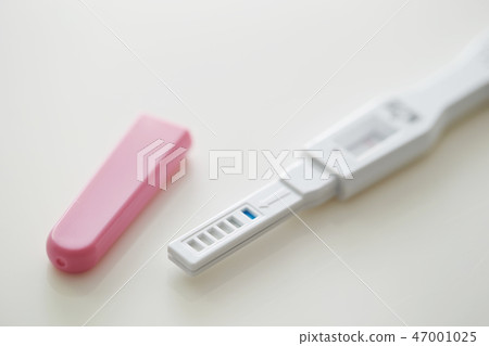 Pregnancy test white background 47001025
