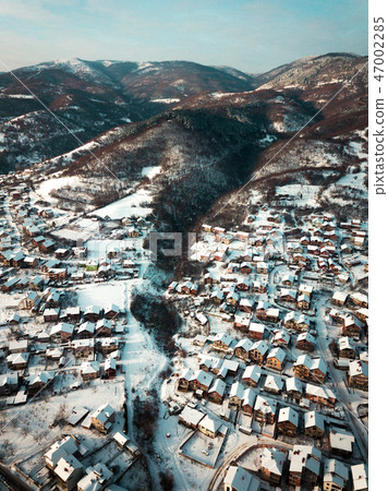 Aerial of a small mountain village 47002285
