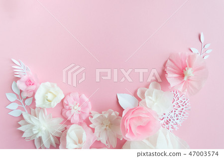 white and pink paper flowers on the pink background white and pink paper flowers on the pink background 47003574