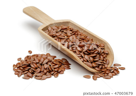 Flax seeds in wooden spoon Flax seeds in wooden spoon 47003679