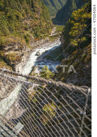 Suspension bridge on the way to Namche Bazar Suspension bridge on the way to Namche Bazar 47004064