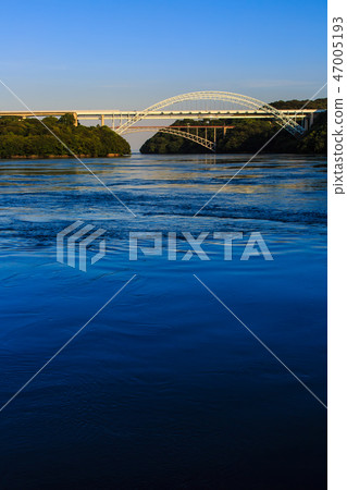 Sunset on the Saikai Bridge and the Shinseikai Bridge [Sasebo City, Saikai City, Nagasaki Prefecture] 47005193