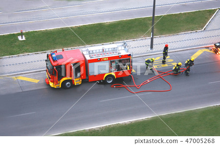 fire drill with four man who fight with the fire 47005268